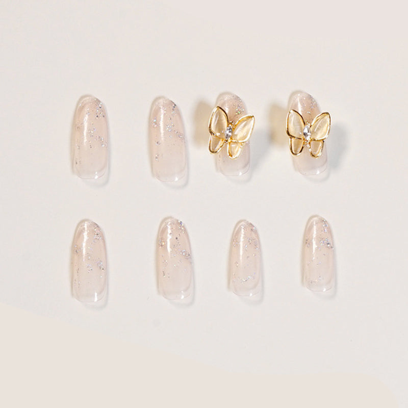 Almond Nägel in Nude mit 3D Schmetterling und Pearl-Design